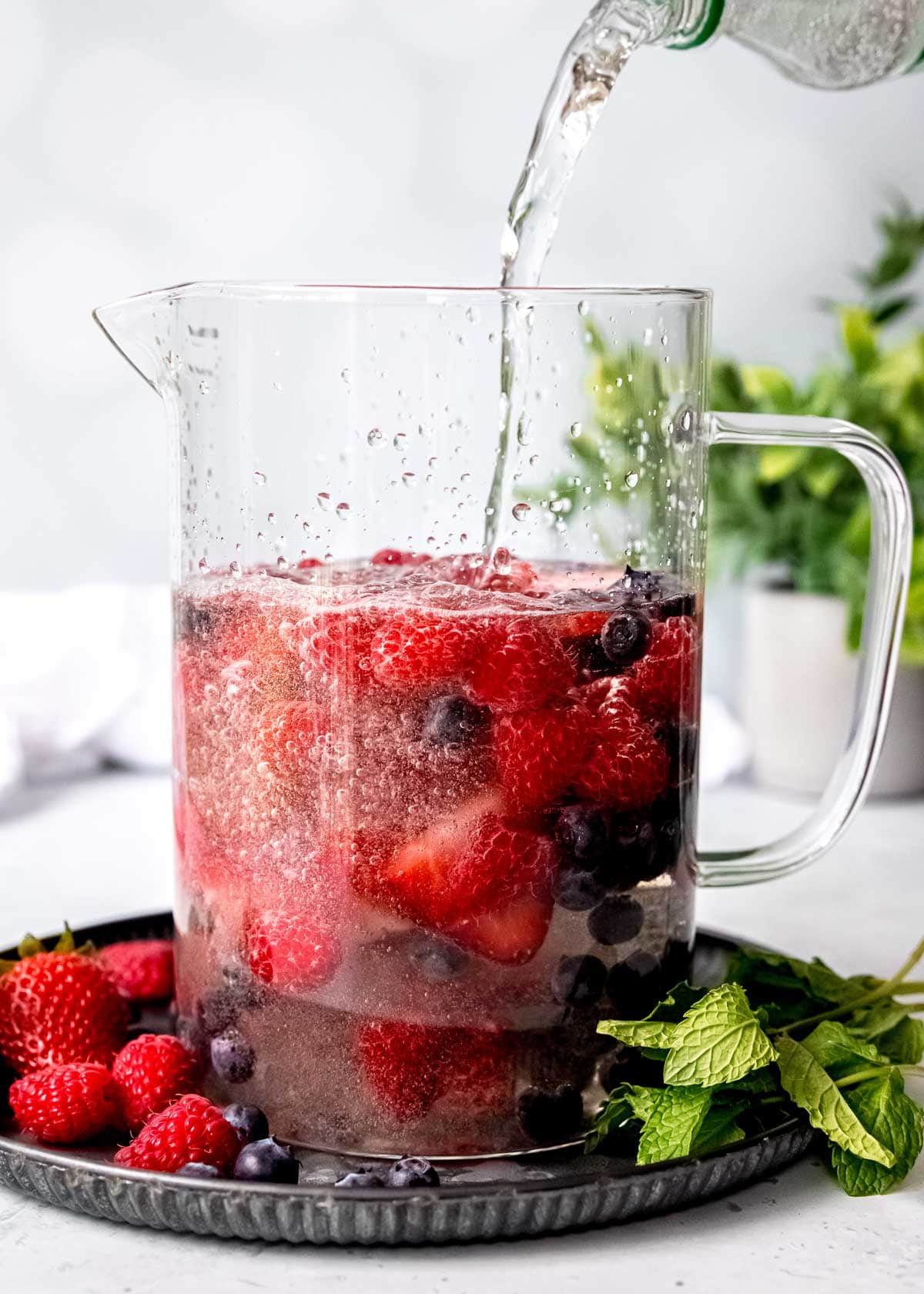 sprite poured into a triple berry white sangria recipe