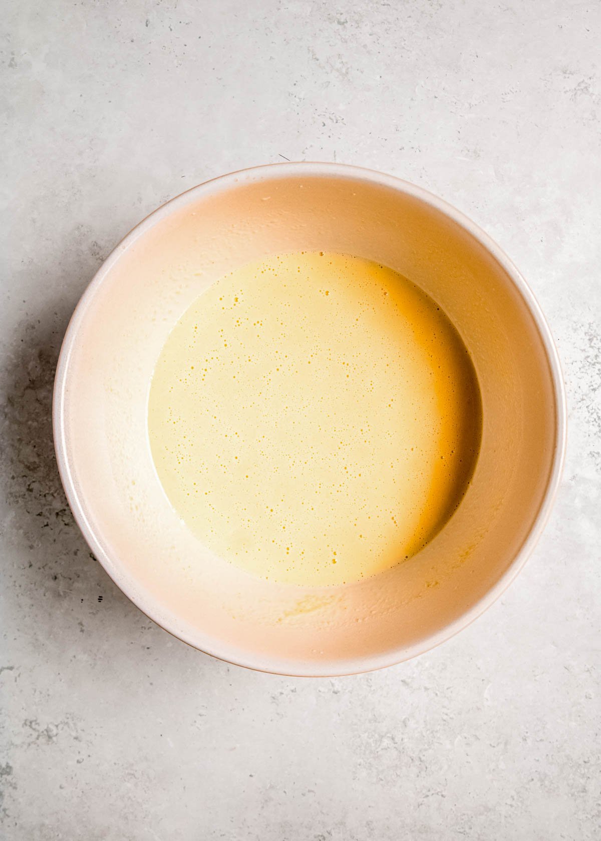 vanilla pudding in a white bowl