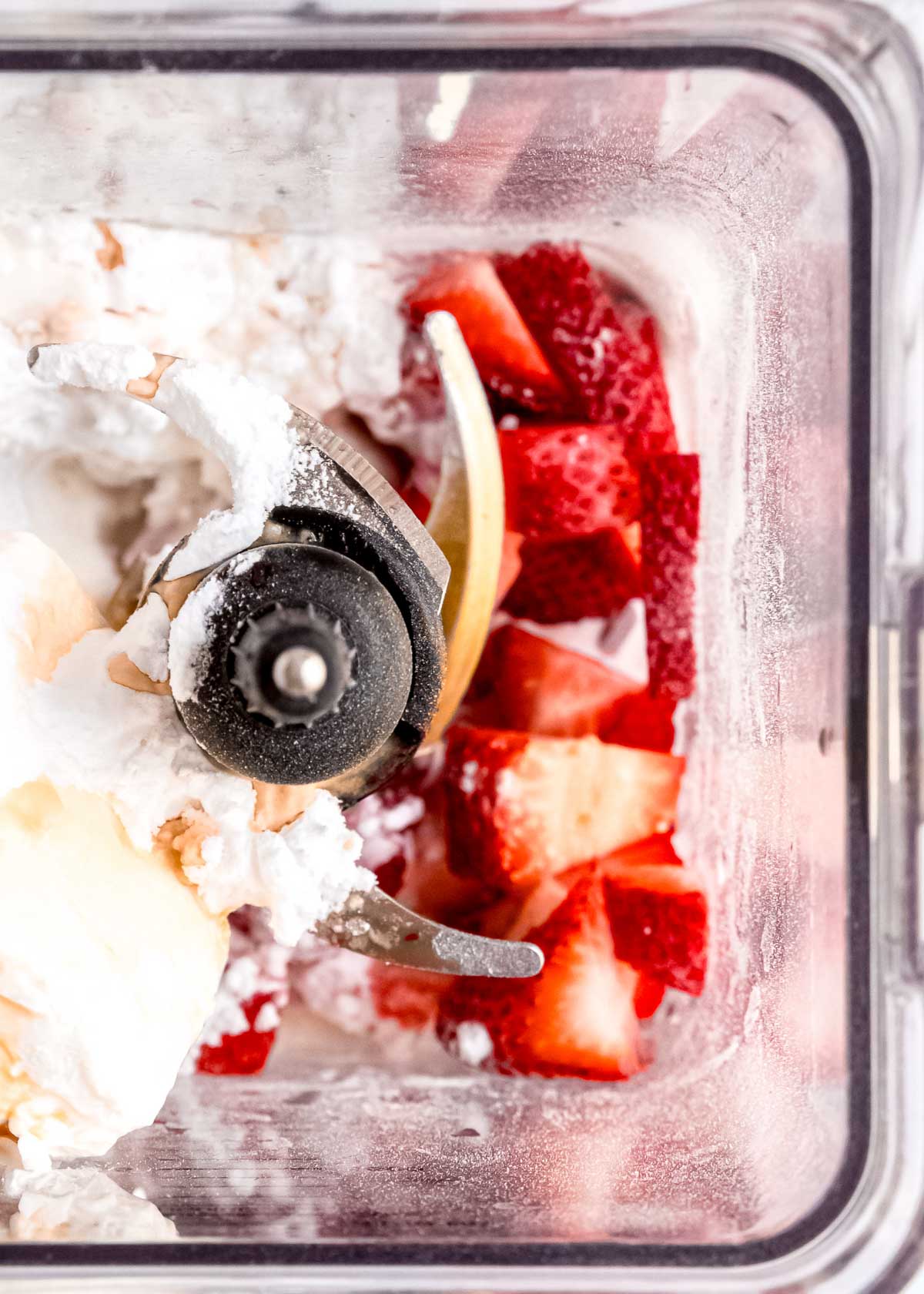 strawberries, milk, and pudding mix in a blender