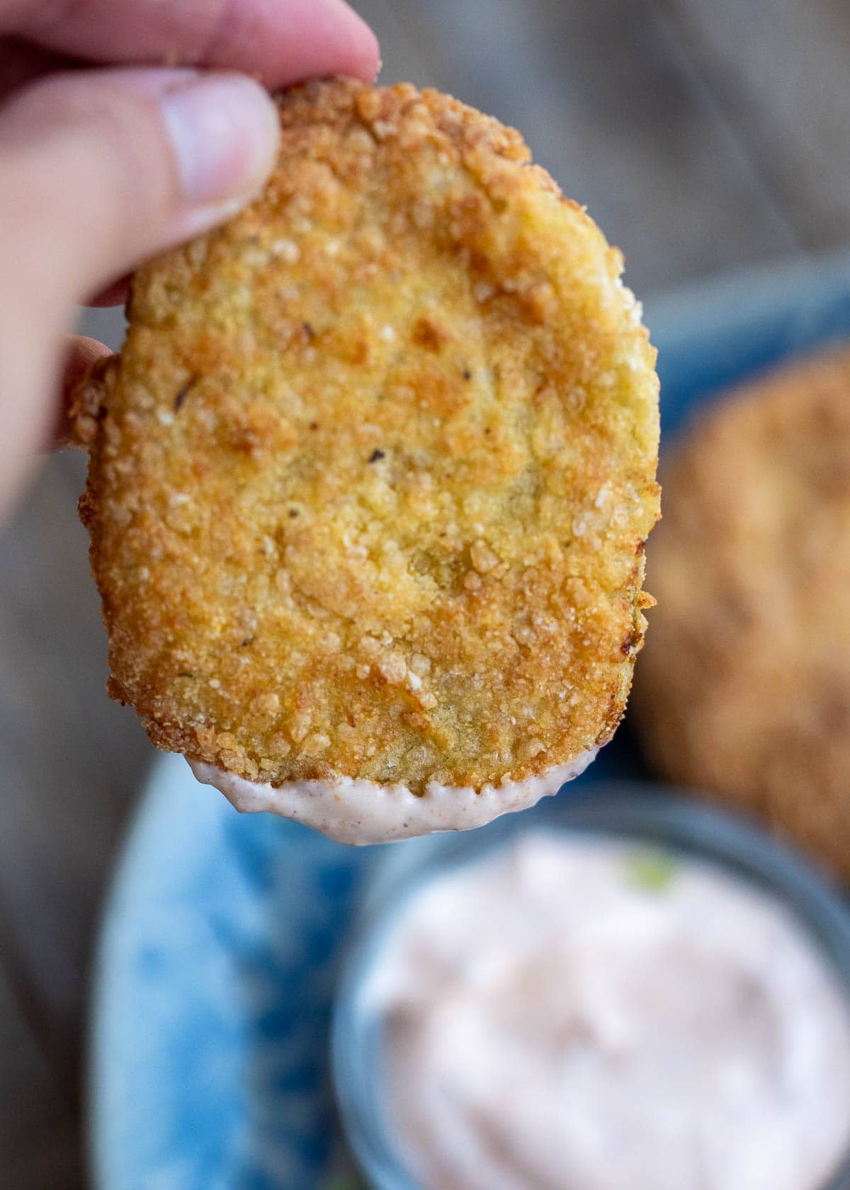 a crunchy fried green tomato dipped in remoulade
