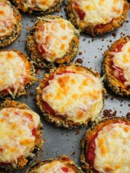 Zucchini parmesan bites on a baking sheet