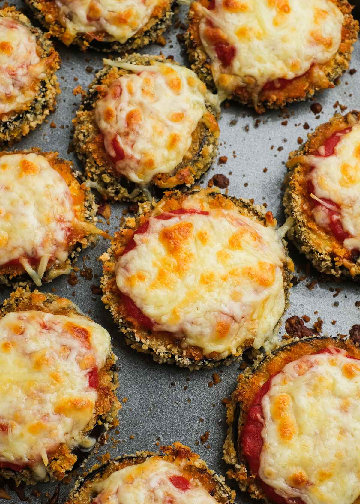 Zucchini parmesan bites on a baking sheet