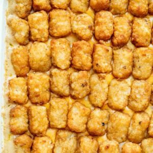 Bubbly cheesy cowboy casserole topped with crispy tater tots