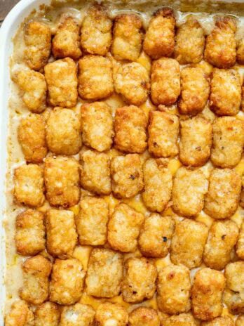 Bubbly cheesy cowboy casserole topped with crispy tater tots