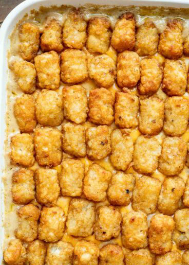 Bubbly cheesy cowboy casserole topped with crispy tater tots