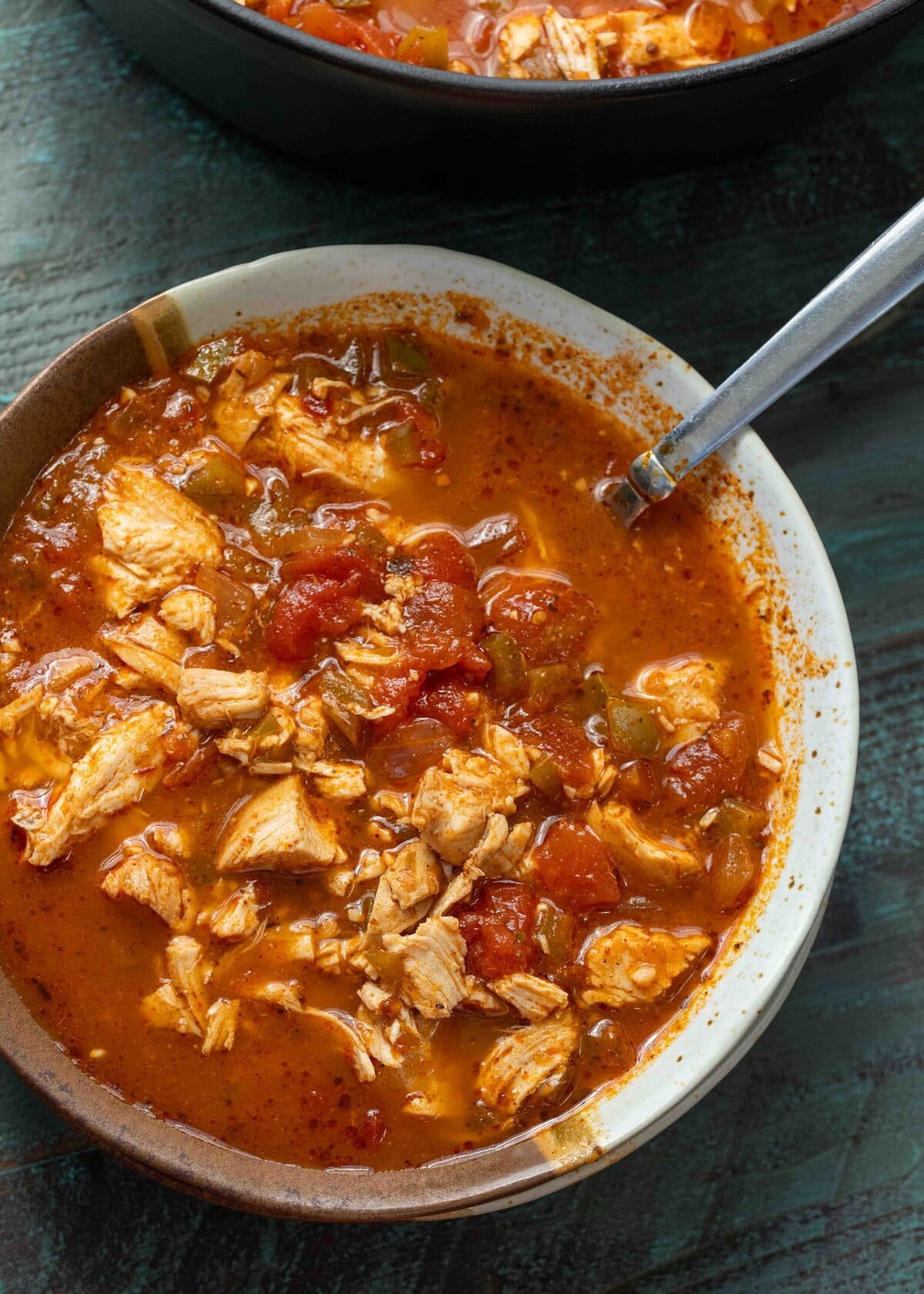 overhead shot of a bowl of spicy chicken keto soup