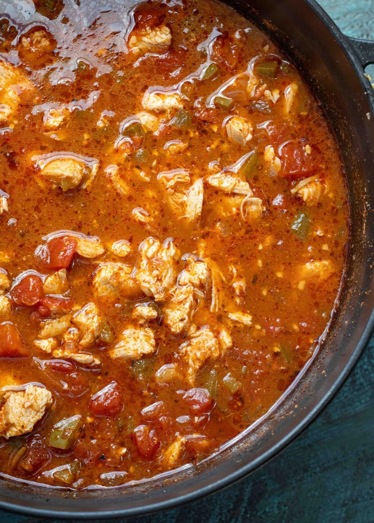 chicken and peppers mixed into a spicy soup