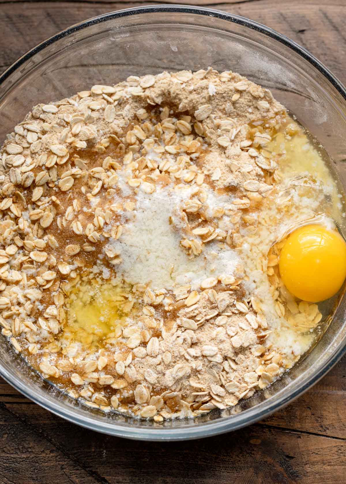 oats, flour, egg, baking powder, salt, pumpkin pie spice, melted butter, and brown sugar in a bowl
