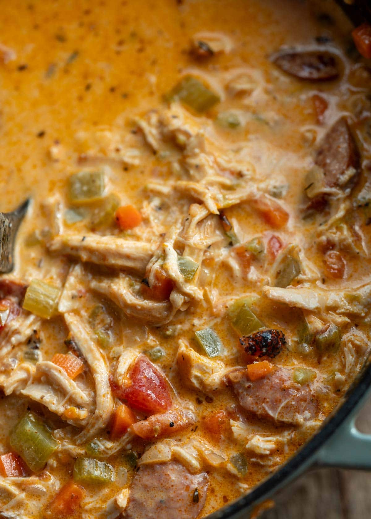 creamy cajun soup filled with chicken, sausage, and vegetables