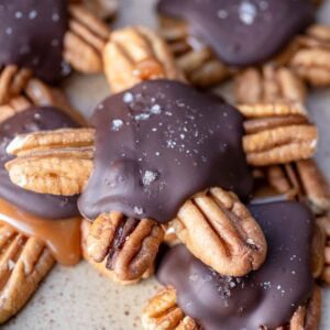 several pecan turtles piled on a plate