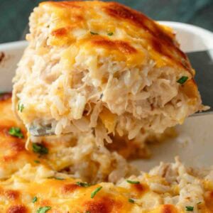 A large, cheesy serving of chicken rice casserole