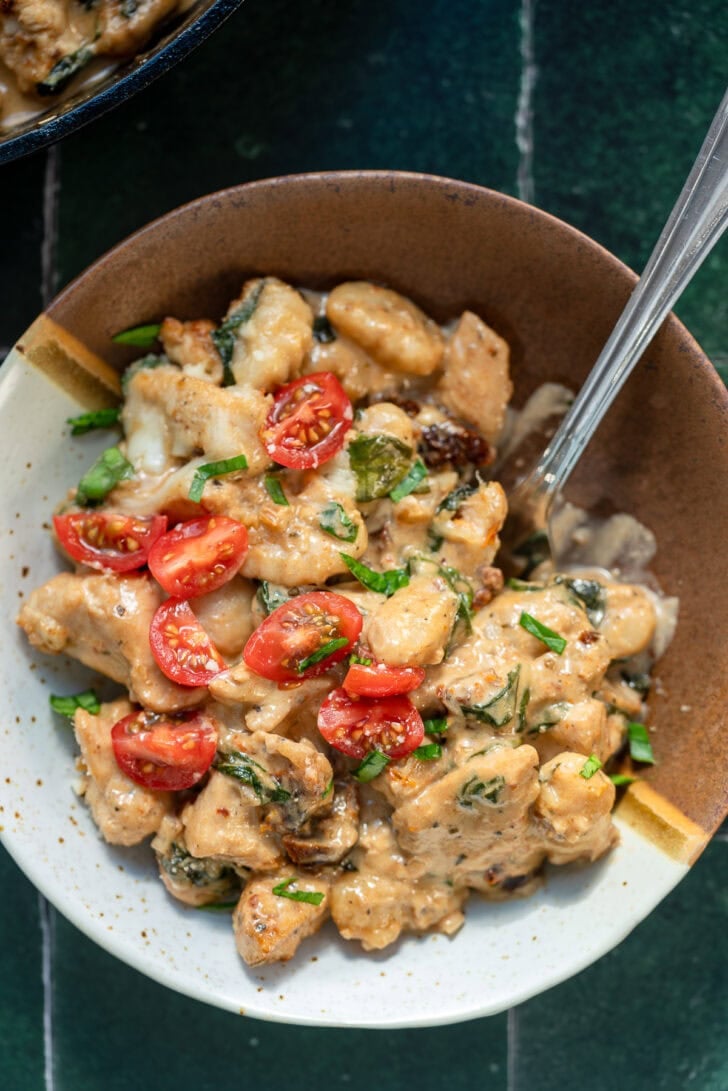 marry me chicken gnocchi in a bowl with a spoon