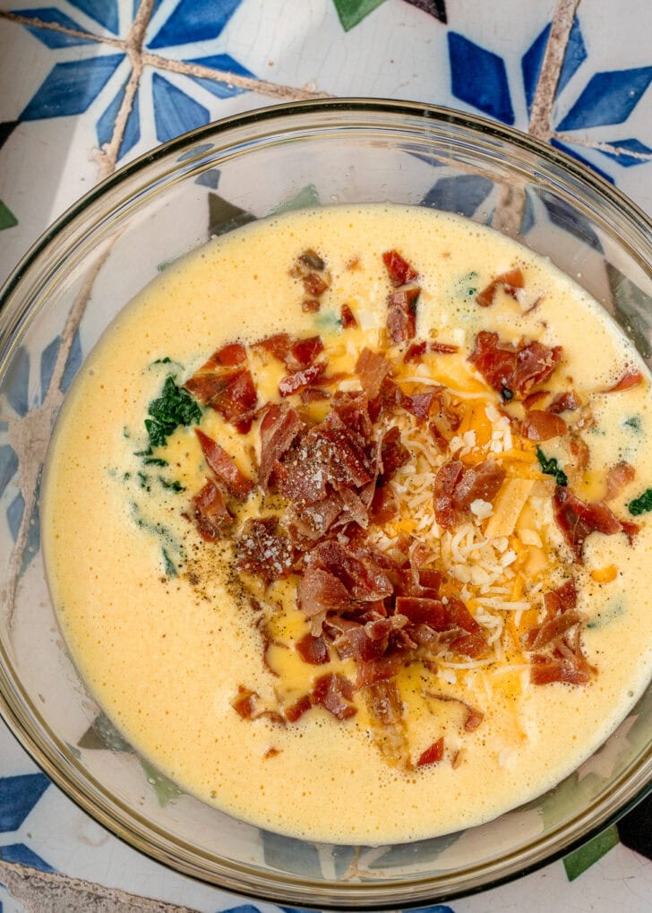 eggs beaten with cottage cheese, then mixed with spinach, cheese, and prosciutto