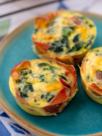 three spinach egg muffins on a plate