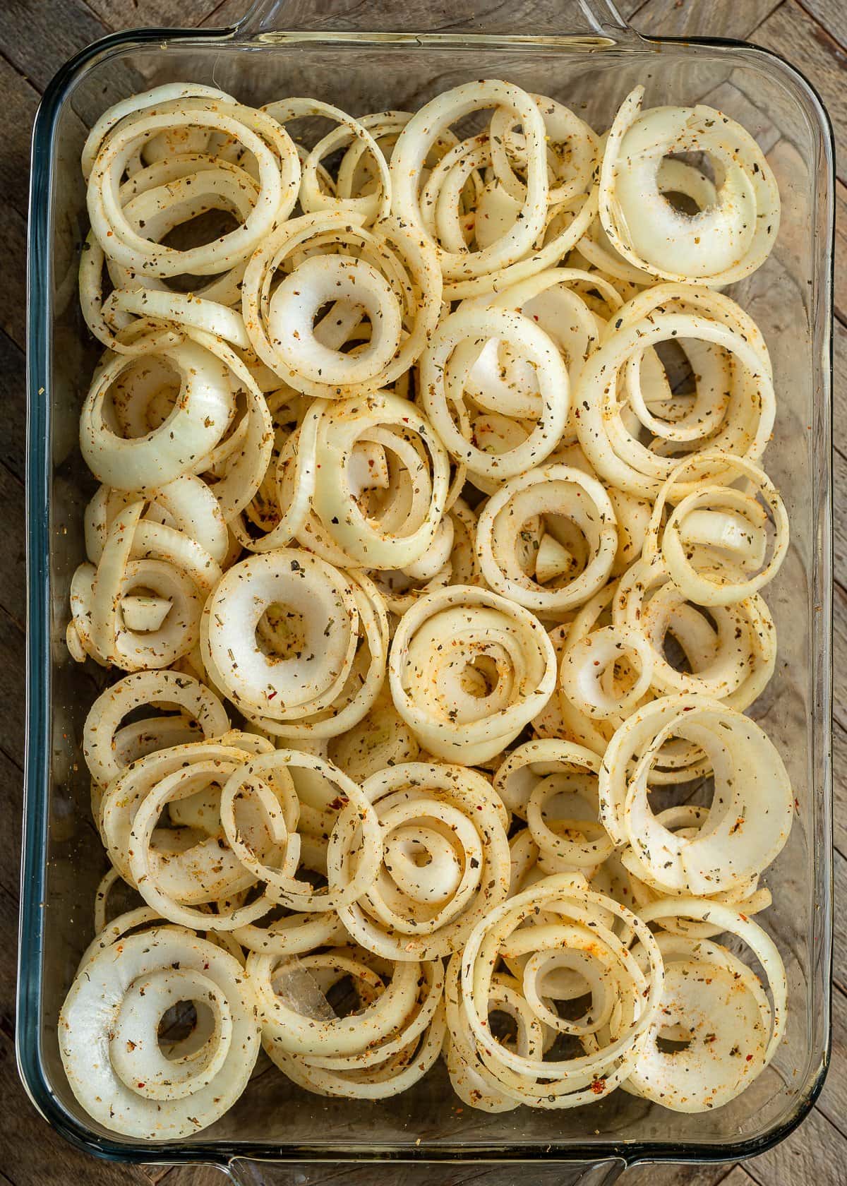 sliced onions in a baking dish
