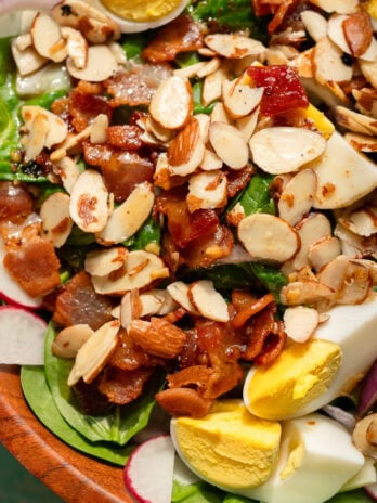 closeup shot showing the easy spinach salad with hot bacon dressing
