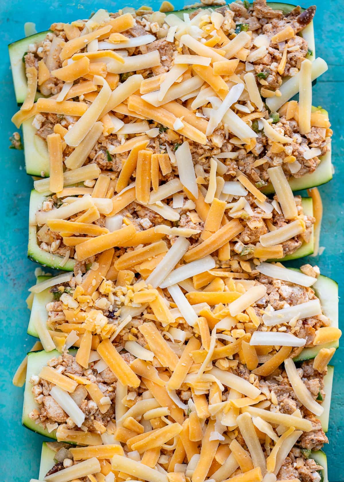 zucchini boats filled with a creamy chipotle chicken and cheese mixture