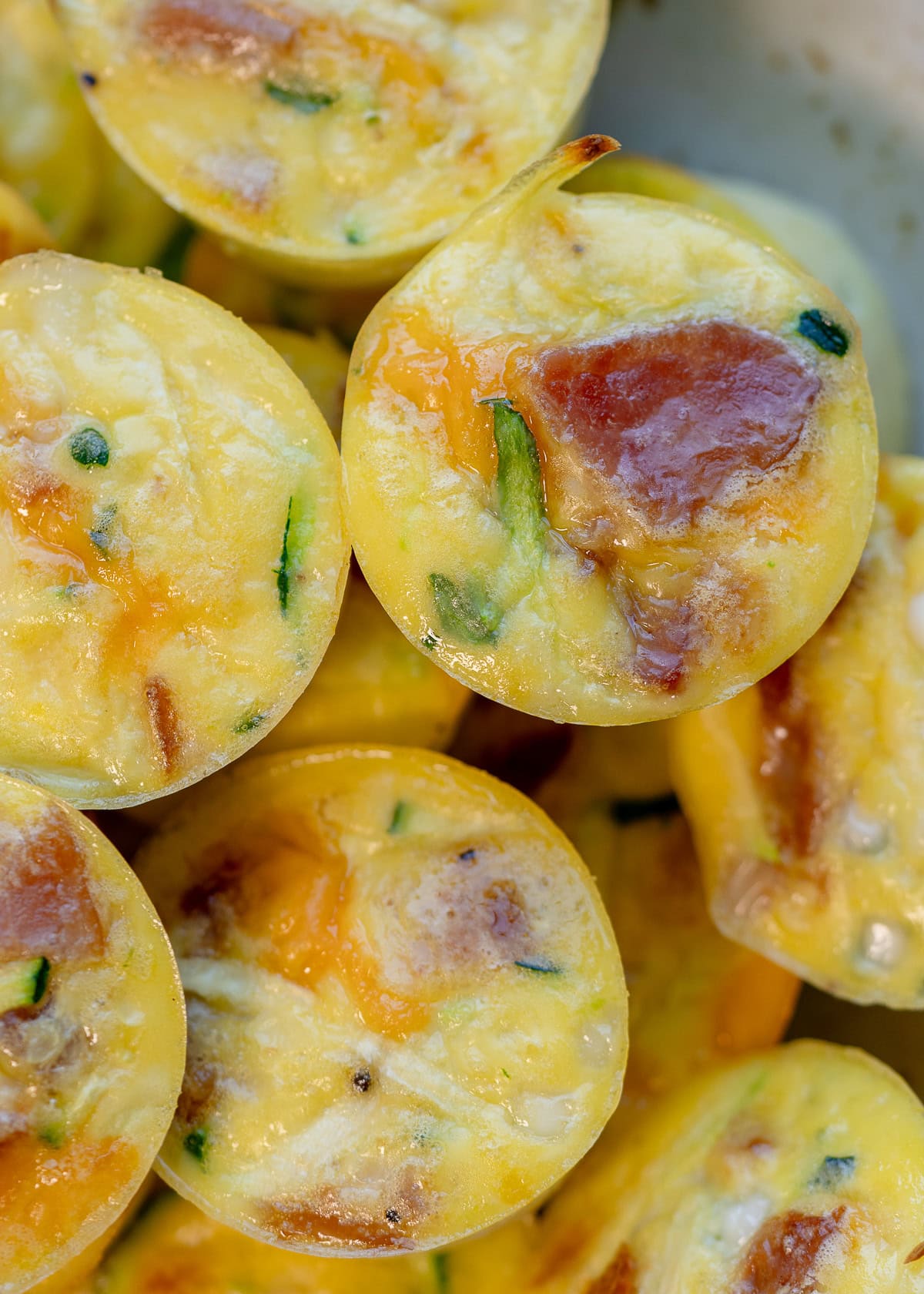 several zucchini egg bites on a platter for make ahead breakfast
