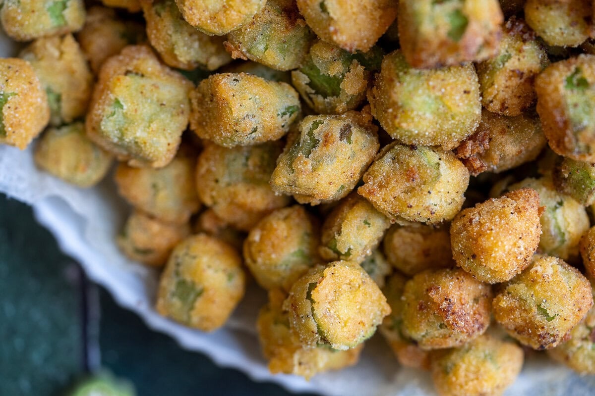 closeup of crispy fried okra with cornmeal breading
