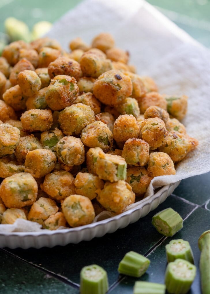 fried okra on paper towel lined plate