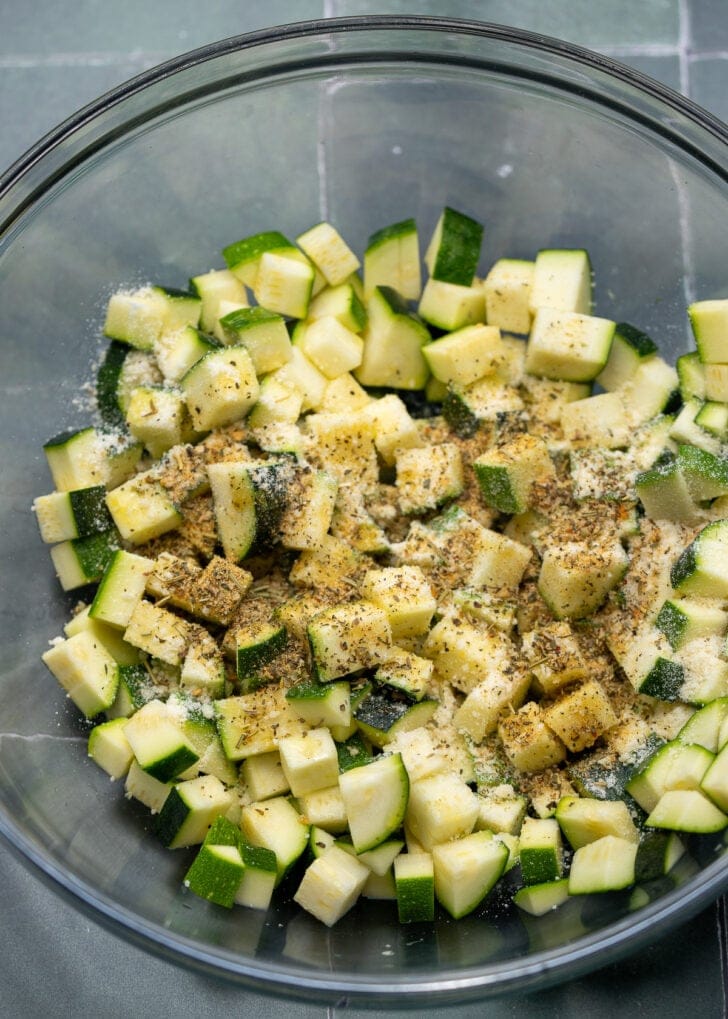 ingredients for air fryer zucchini in a bowl