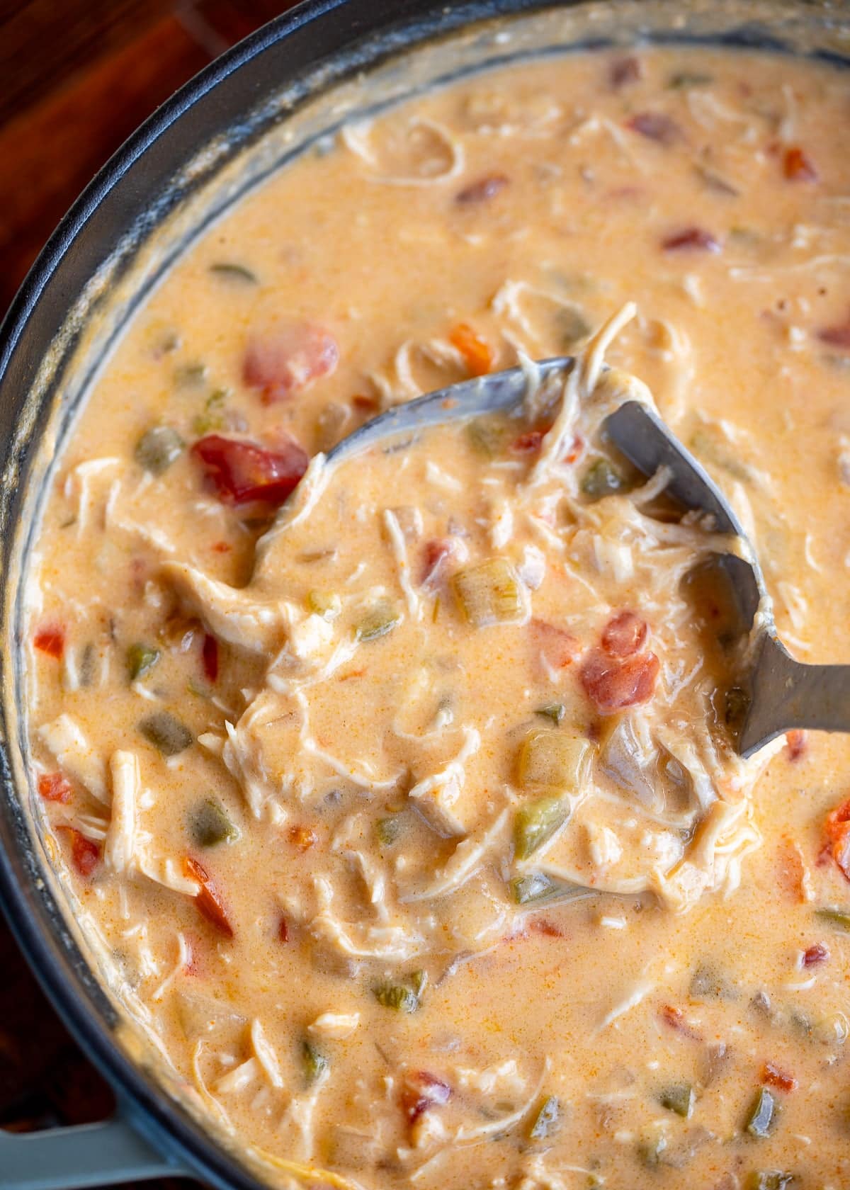 a large pot full of chicken taco soup with a ladle