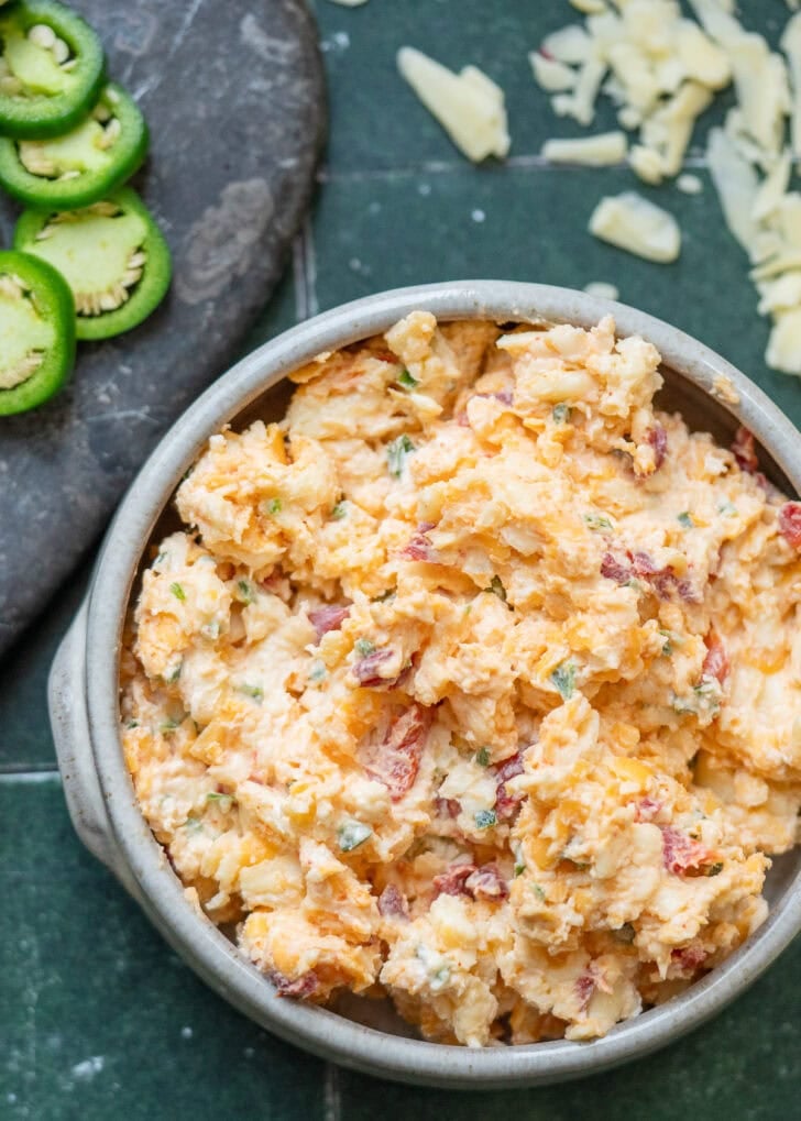 pimento cheese dip ingredients mixed together in a bowl