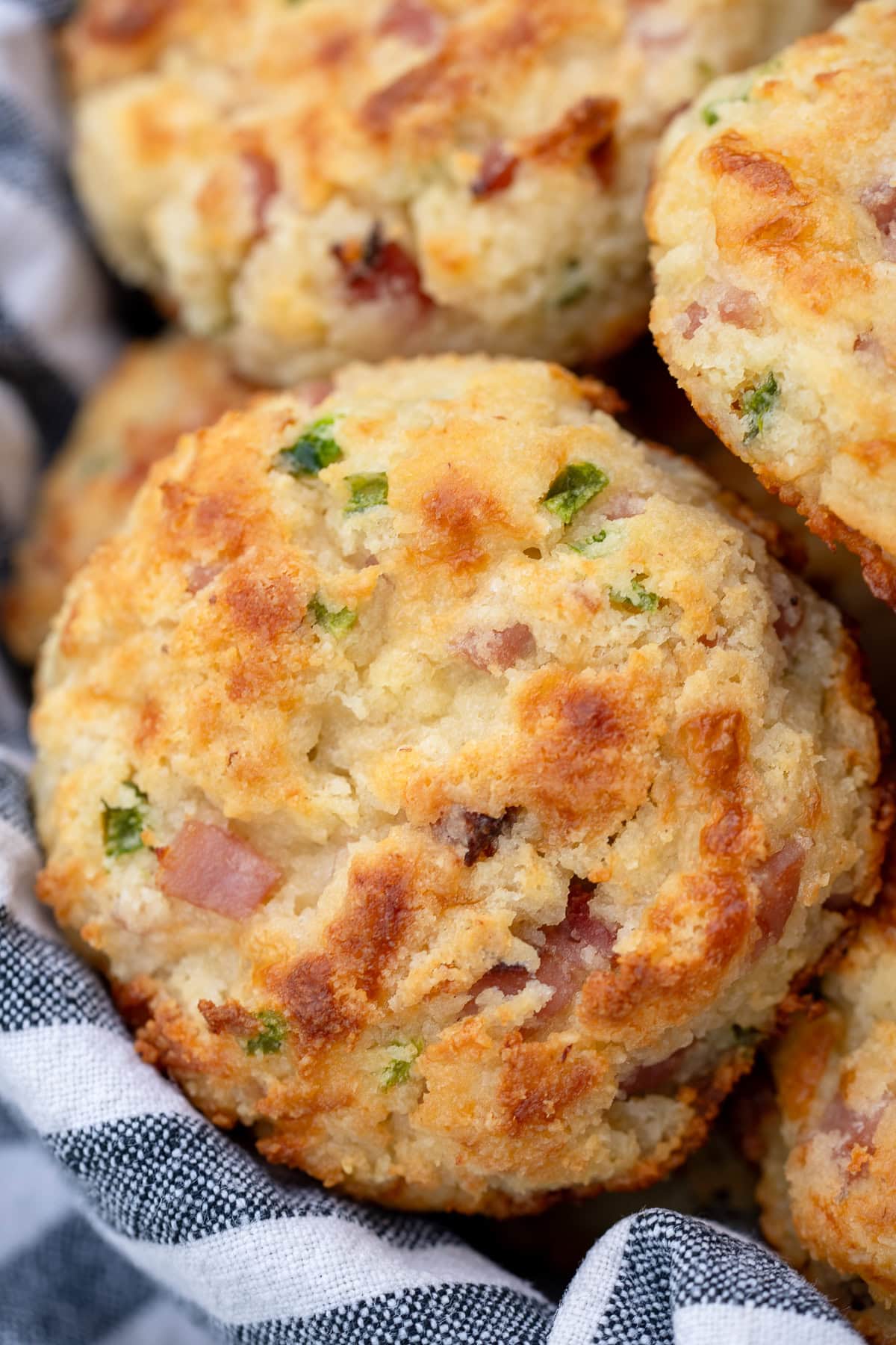closeup image of golden brown cottage cheese biscuits with almond flour, ham, and jalapeno